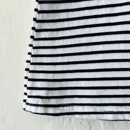 Close-up of a black and white striped fabric on a light background