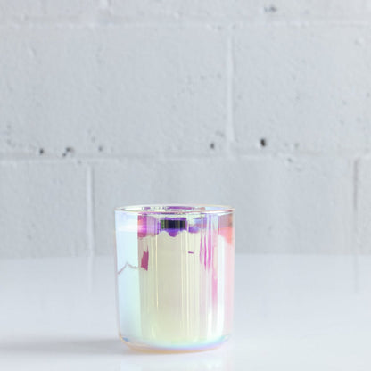 iridescent 7 oz candle with black wooden wick in citrus and floral scent