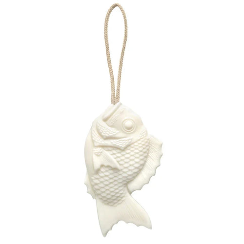 Tamanohada Lily Welcome Soap in the shape of a Japanese bream fish, white plant-based soap with detailed scale texture, hanging from a natural braided linen rope — product view on white background