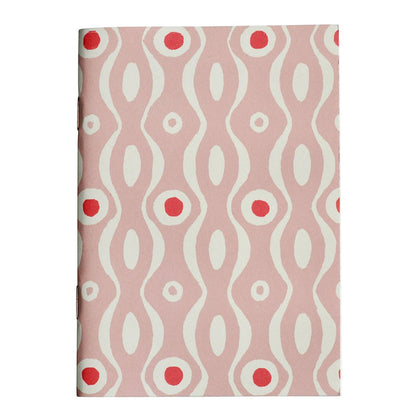 Notebook with a pink and white wavy pattern on a white background
