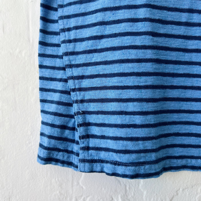Close-up of a blue and navy striped shirt on a white background