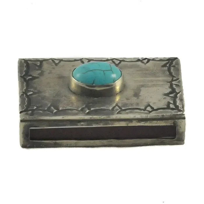 J. Alexander Small Stamped Matchbox with Turquoise closed on a white background — top-down view of an oxidized silver matchbox cover with a bezel-set turquoise cabochon, Navajo-inspired stampwork border, and striker strip