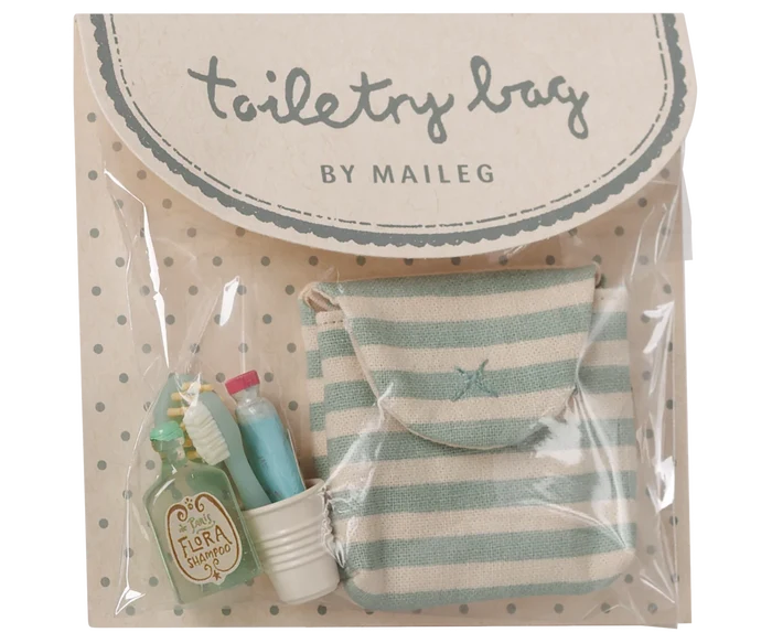 Maileg Toothbrush Set in Blue Striped Bag — product in original Maileg packaging showing the blue and cream striped cotton bag with miniature accessories including a Flora Shampoo bottle, toothbrush, toothpaste tube, and ribbed water cup