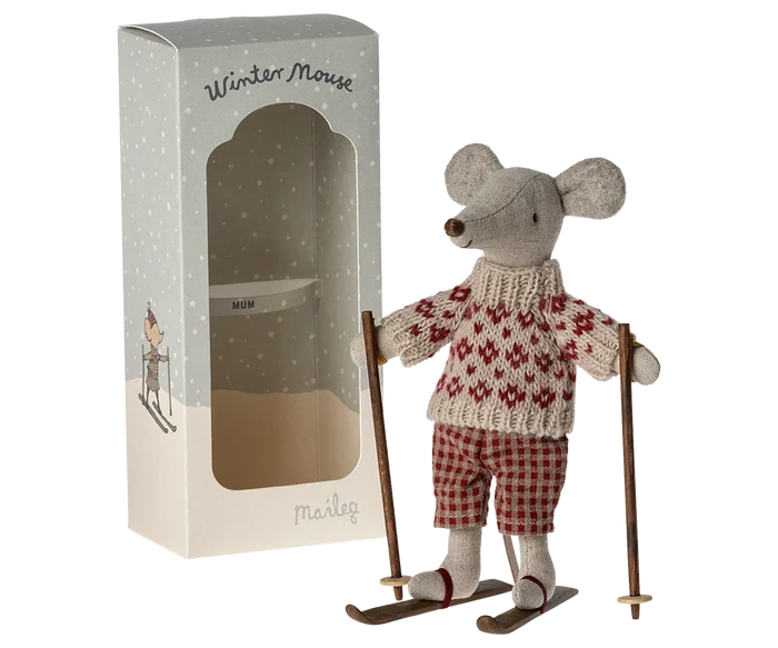 Maileg Winter Mouse Ski Mum — linen mouse doll in a red Fair Isle knit sweater and red gingham pants, standing on wooden skis with poles, shown next to its Maileg gift box